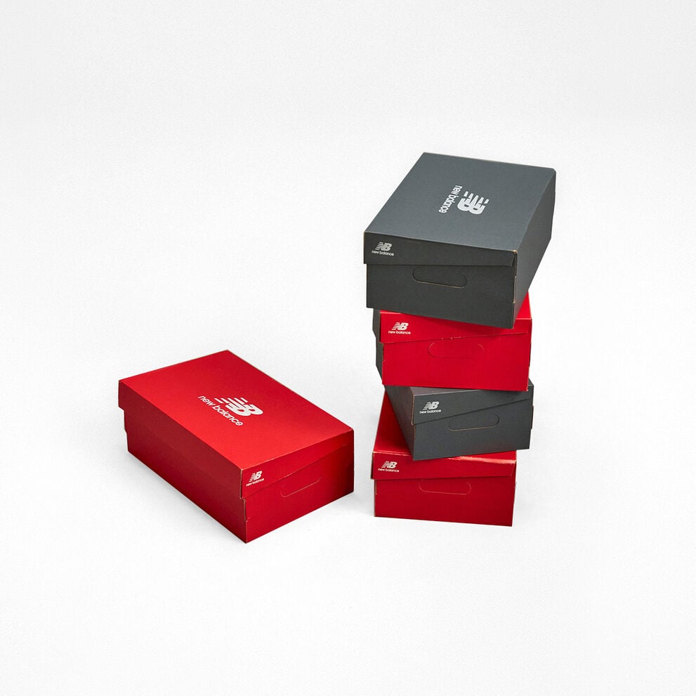 New Balance red and gray shoe boxes stacked. 
